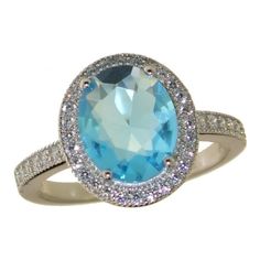 A Shining And Vibrant Large Oval Light Blue Topaz Gemstone (3.60 Ct) With Accent Stones (White) Surrounding. Beautiful Ring! Size 7 Lab Created Blue Topaz Gemstone, Sterling Silver (.925) Setting Oval Blue Topaz Ring With Halo Setting, Blue Oval Topaz Ring With Halo Setting, Blue Topaz Gemstone, Topaz Gemstone, Beautiful Ring, Blue Topaz Ring, Ring Size 7, Topaz Ring, Womens Jewelry Rings