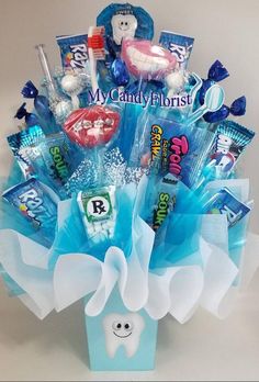 a toothbrush and candy bouquet in a blue box