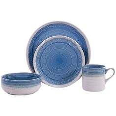 a blue and white dinner set on a white background