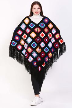 Feeling festive and fabulous in our cozy crochet poncho! ✨ This versatile piece is perfect for layering all season long. Get yours now and add some holiday cheer to your wardrobe! #christmasfashion #crochetponcho #holidaystyle #usamade Bohemian Knit Poncho For Spring, Black Bohemian Shawl For Fall, Bohemian Crochet Long Sleeve Top One Size, Bohemian Knit Poncho, Black Bohemian Shawl For Spring, Bohemian Knit Poncho With Fringe, Bohemian Crochet Top With Crochet Trim For Fall, Bohemian Knit Shawl One Size, Bohemian One Size Knit Shawl