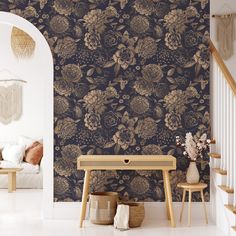 a wallpapered room with flowers on it and a table in the foreground