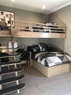 a bedroom with bunk beds and chairs in it