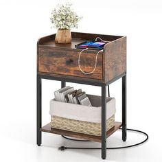 a small wooden table with a drawer on it and a cell phone sitting on top