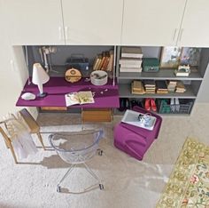 a room with a desk, chair and bookshelf