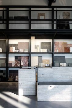 the interior of a building with many different types of tiles on display in front of it