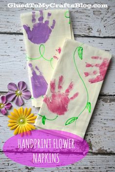 two handprinted napkins with flowers on them