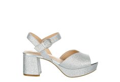 Xappeal Vivi Womens Platform Sandal Relive the age of disco in the Xappeal Vivi womens platform Sandal. The chunky 3 1/2” platform heel is reminiscent of funkier times, while the glittery upper with buckle strap closure keeps your foot secure for the road ahead.  Synthetic upper  Buckle strap closure  Platform style Heel height: 3 1/2  Synthetic outsole Platform Silver Shoes, Silver Platform Sandals With Block Heel, Silver Platform Heels With Ankle Strap, Silver Platform Heels In Synthetic Material, Metallic Open Toe Platform Sandals, Silver Open Heel Platform Sandals, Rack Room Shoes, Silver Shoes, Platform Heels