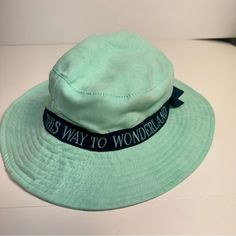 Nwt. Disney Parks Epcot Uk World Showcase Alice In Wonderland Bucket Hat. Mint Green With Navy Blue Trim And Bow. Interior Has Images From Alice In Wonderland. Blue Trim, Disney Accessories, Disney Parks, Alice In Wonderland, Mint Green, Bucket Hat, Blue Green, Navy Blue, Mint