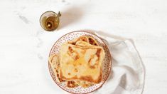 some food is sitting on a plate next to a cup