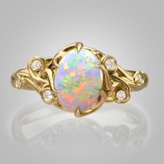 "A handmade 14k gold ring set with a beautiful oval opal and white diamonds. ----> A video is available here - https://youtu.be/Ggt0E_E0iS4 The pictured opal is sold. Opal #1 Dimensions - 7mmX9mmX2.7mm, 1.18ct Australian 1550$ Opal #2 Dimensions - 6.9mmX9mmX3mm, 1.2ct Australian 1300$ Opal #3 Dimensions - 6.8mmX8.7mmX3.1mm, 1.26ct Australian 1650$ Opal #4 Dimensions - 7mmX8.8mmX2.5mm, 0.98ct Australian 1200$ Opal #5 Dimensions - 9.1mmX7.1mmX3.2mm, 1.2ct Australian 1650$ Opal #6 Dimensions - 9.1m Engagement Ring Opal, Rose Gold Opal Ring, Rose Gold Ring Set, Large Stone Rings, Australian Opal Ring, Twig Engagement Ring, Engagement Rings Twisted, Opal Engagement Ring, Ring Opal