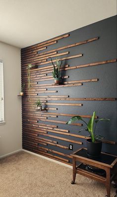 a living room with some plants on the wall