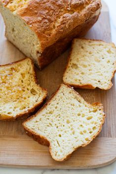 sliced loaf of bread sitting on top of a cutting board