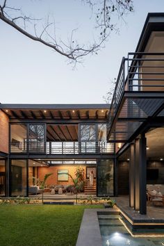 an outdoor area with grass and stairs leading up to the house's upper level