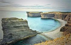 the water is crystal blue and clear at this point in the cliffs near the beach