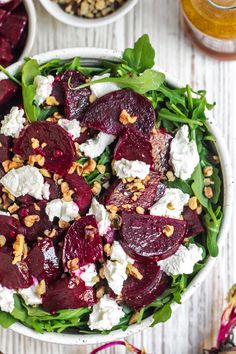 beet salad with goat cheese and walnuts in a white bowl