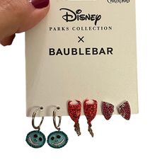 disney parks collection x baublebar earrings with swarongs on them