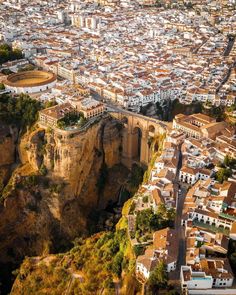 an aerial view of the city and its surrounding cliffs