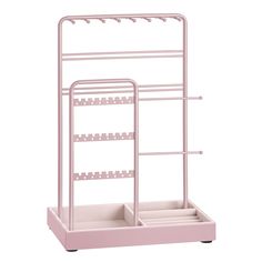 a pink rack with three shelves and two trays on each side, in front of a white background