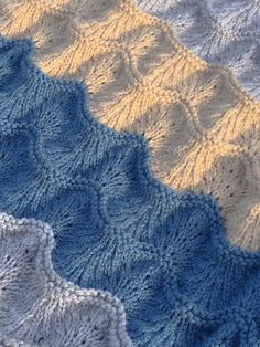 three crocheted afghans sitting next to each other