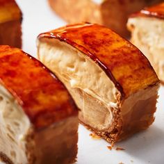 several pieces of dessert sitting on top of a white plate