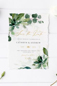 an elegant greenery wedding save the date card