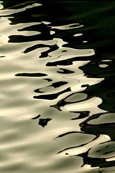 the water is very calm and reflective from the sun