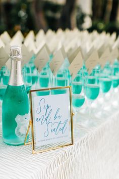 a table topped with lots of glasses and bottles