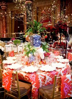 the table is set with red and white cloths