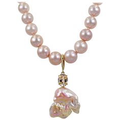 Gorgeous, large peachy pink Baroque Pearl, oval 5.04 carat Morganite and accent white diamond 14k yellow gold enhancer pendant on a graduated, round 12-15mm pink freshwater pearl beaded necklace. Necklace is finished with 14k gold chain and a swivel lobster clasp. Beaded pearl necklace is 20 inches in length. Pendant, including bail, is 2.69 inches in length. One-of-a-kind, exquisite statement necklace and future heirloom. Affordable Pink Necklace With Pearl Charm, Luxury Gold Oval Pearl Necklace, Luxury Drop Jewelry With Pearl Charm, Pink Pearl Jewelry, Pink Baroque, Baroque Pearl Pendant, South Sea Pearl Necklace, 1st Dibs, Tahitian Pearl Necklace