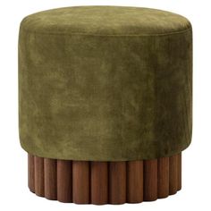 a round stool with wooden legs and a green velvet upholstered cover on top