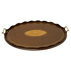 an oval serving tray with gold accents