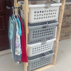 the closet is organized with baskets and clothes