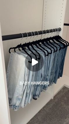 an image of clothes hanging on racks in the closet with text overlay that reads baby hangers