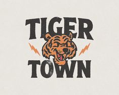 the tiger town logo is shown in black and orange