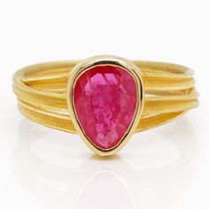 Details: Ruby, pear shape, rose cut, 1.56 carats, 7.5x9.5mm Three ribbon ring in 18k yellow gold with contrasting satin and polished finish Ring Size 6.5 Explore Barbara Heinrich's Bio & Catalog here. Please contact us for resizing options, special order inquiries, or any other questions. Gold Pear-shaped Ruby Ring, Pear-shaped Yellow Gold Ruby Ring, Ruby Ribbon, Ribbon Ring, Nail Jewels, 2024 Vision, Pear Shape, Alchemy, Druzy Ring