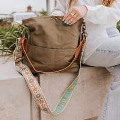 This Versatile Bag Can Work As A Crossbody Or Shoulder Bag. The Bag Comes With A Removable Pu Leather Shoulder Strap And A Canvas Crossbody Strap. Features A Magnetic Closure And 2 Front Pockets To Keep Your Contents Safe! The Interior Features A Black Nylon Lining With A Small Zipper Pocket. Body: 12" X 15" X 4" Pu Leather Shoulder Strap: 27" Canvas Crossbody Strap: 27-48" Width: 2" The Canvas Strap Is More Lightweight Than Our Original Canvas Straps, With Embroidery On One Side. Main Material: Green Hobo Bag With Adjustable Strap For On-the-go, Daily Use Khaki Bucket Bag With Adjustable Strap, Khaki Shoulder Bag With Removable Pouch For On-the-go, Khaki Bucket Shoulder Bag With Adjustable Strap, Khaki Bucket Bag With Adjustable Strap, Khaki Shoulder Bag With Adjustable Strap, Khaki Bucket Bag With Adjustable Strap And Tote Shape, Green Tote Shoulder Bag With Detachable Strap, Green Bucket Bag With Detachable Strap