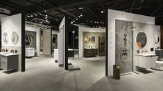 a showroom with several different types of sinks and mirrors