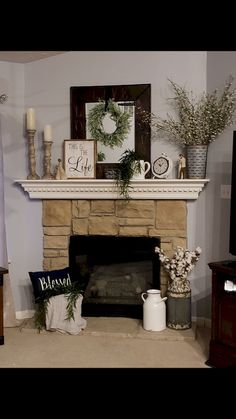 a living room filled with furniture and a fire place in front of a flat screen tv