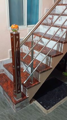 a stair case with marble steps and handrails