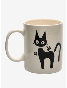 a white coffee mug with a black cat on it