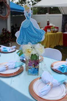 there is a table set with plates, napkins and place settings for the party