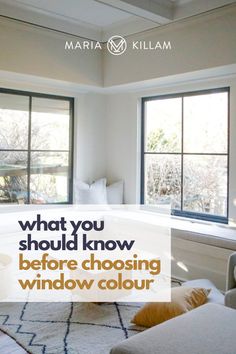 a living room filled with furniture next to two windows and the words what you should know before choosing window color