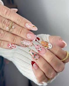 This delightful design features a mix of festive elements like glittering Christmas lights, bows, and a hint of sparkle. The almond-shaped nails alternate between red and nude bases, with each nail showcasing a unique design. This playful yet elegant look is perfect for those who want their nails to reflect the joy and magic of the holiday season. Holiday Nail Ideas, Christmas Nail Ideas, Red And Gold Nails, Quick Nail Art