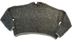 Elevate your casual style with this trendy Urban Outfitters gray cropped oversized sweater. The metallic silver trim adds a touch of sophistication to the relaxed fit pullover. It's perfect for travel, holidays, or any casual occasion. Crafted from 66% acrylic and 33% polyester, this sweater is lightweight and stretchy, providing both comfort and style. The fabric type is shearling, and the sweater features long sleeves, a round neckline, and solid pattern. It's available in size S and comes wit Oversized Sweater, Dog Friendly, Solid Pattern, Round Neckline, Sweater Outfits, Casual Style, Metallic Silver, Urban Outfitters, Relaxed Fit