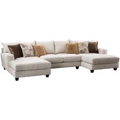 a large sectional couch with pillows on it