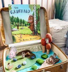 an open suitcase filled with toys and books