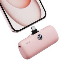 an image of a pink camera and its flash drive