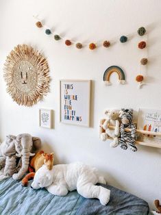 there are many stuffed animals on the bed