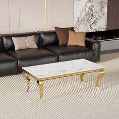 a black leather couch sitting next to a white coffee table