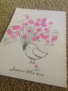 a card with pink hearts and a bird on it that says, welcome little one